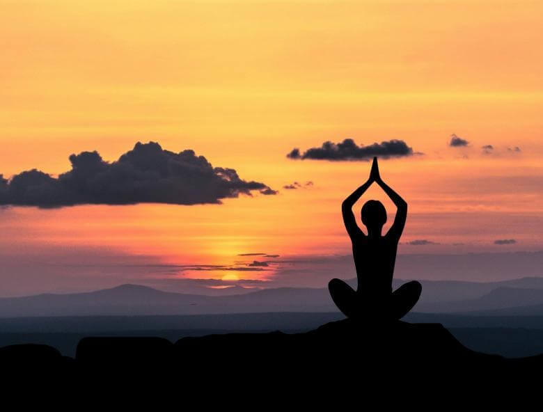 Yoga pose in sunset- Tantra